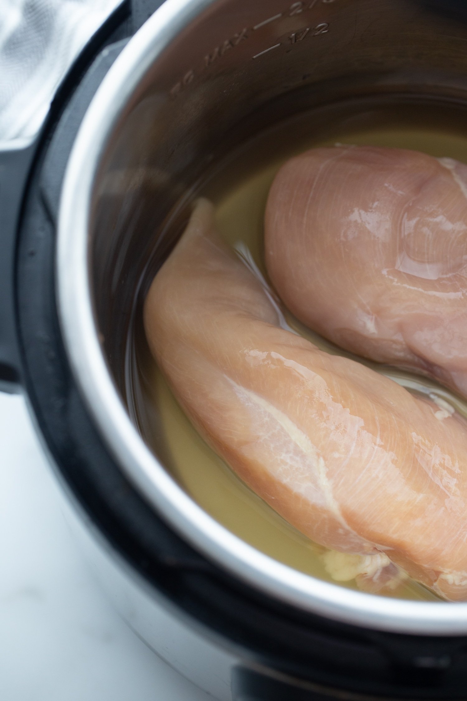 raw chicken breasts in the Instant Pot