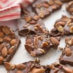 chocolate low carb candy with almonds on a white background