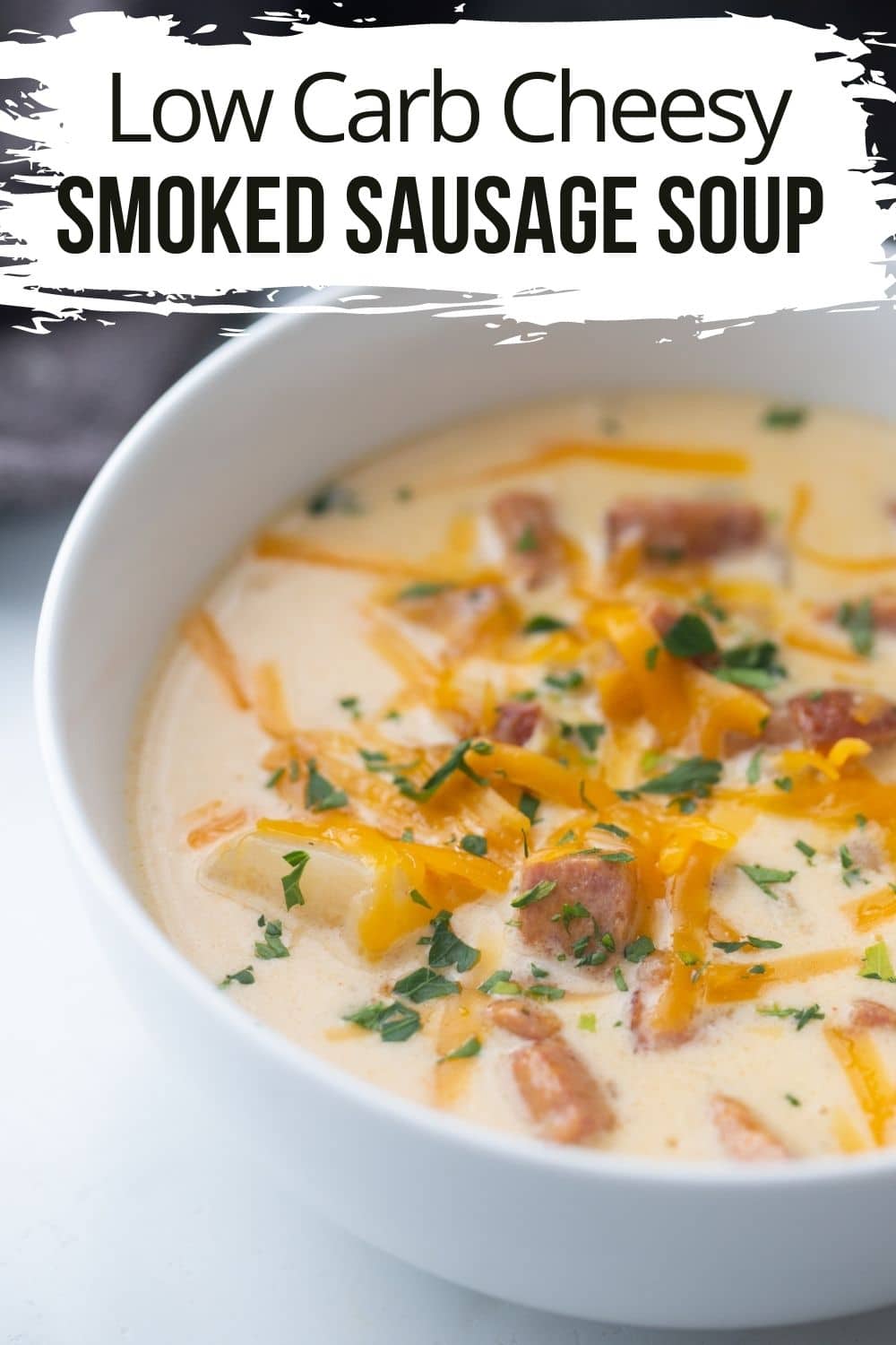 smoked sausage keto soup in a white bowl