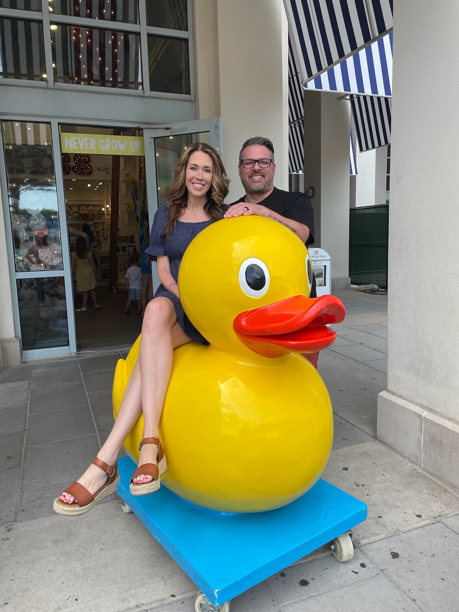 husband and wife picture with a large plastic duck
