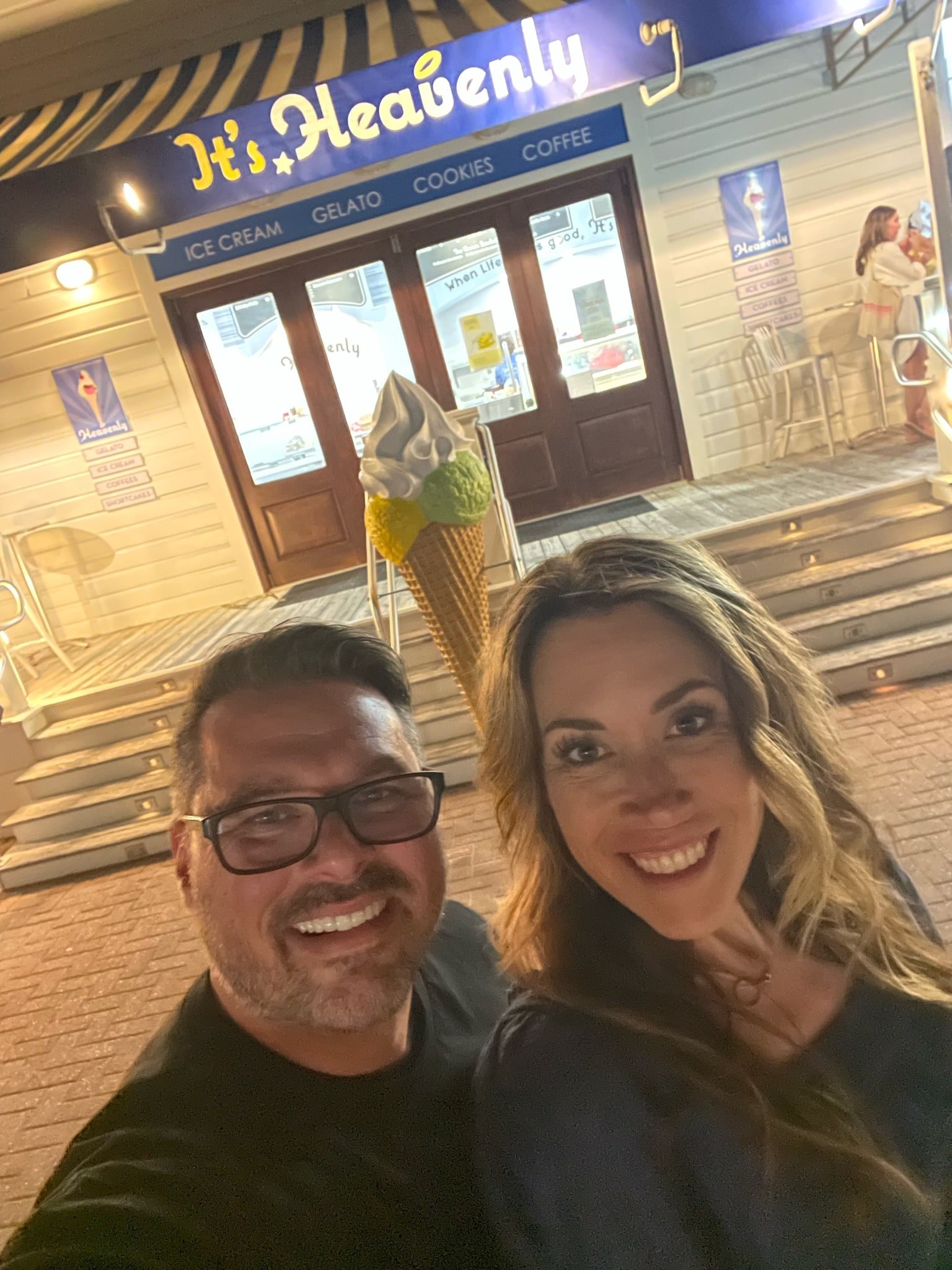 man and woman outside ice cream store 