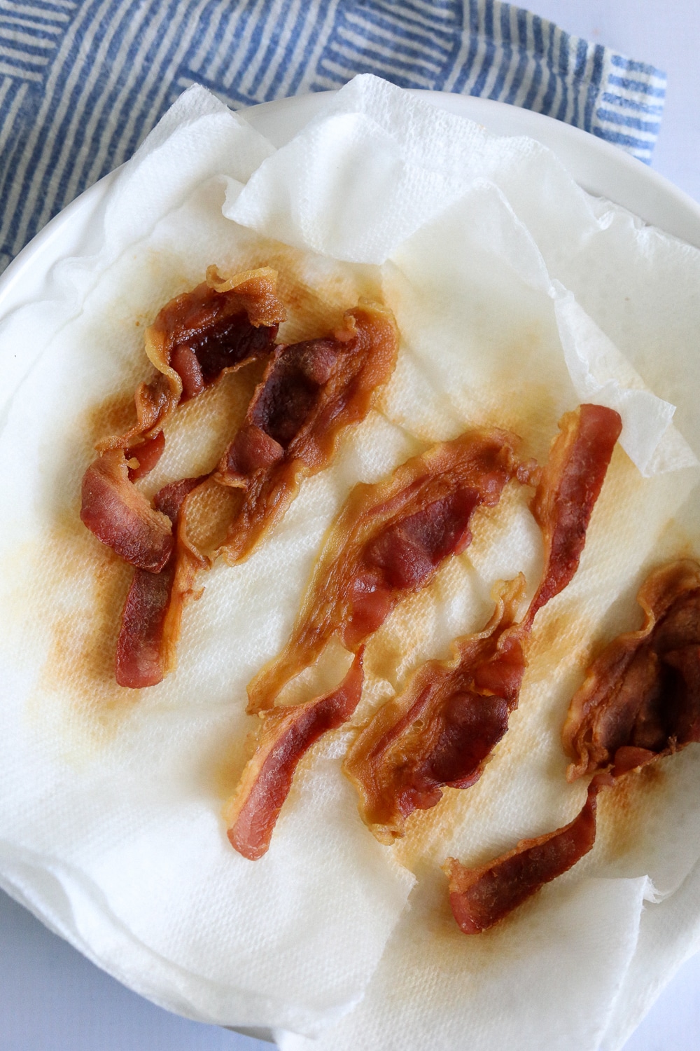 cooked microwave bacon on a plate. 