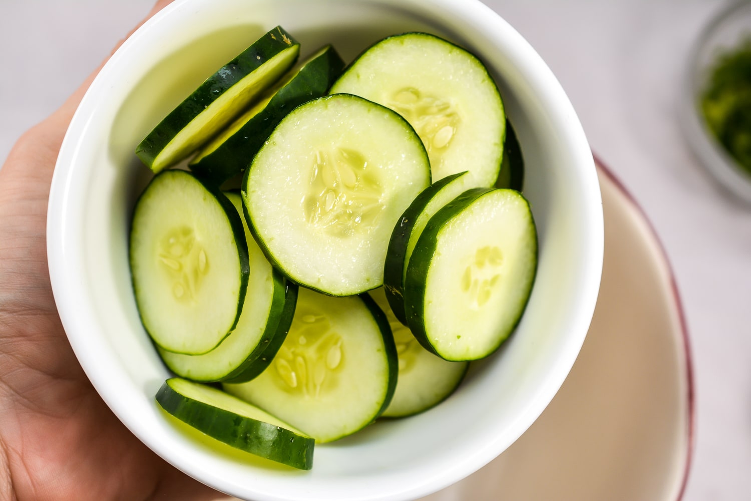 cut up cucumbers in a dish