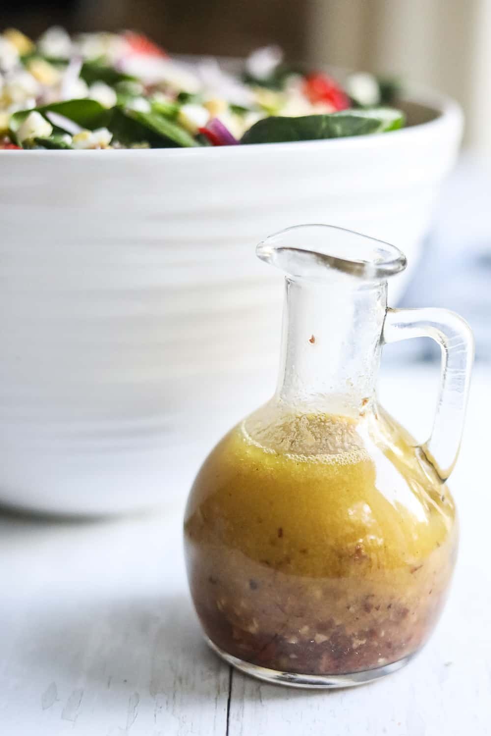 hot bacon dressing in a little glass jug