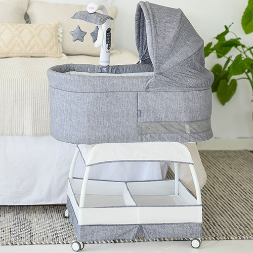 SWEETLI NURTURE BASSINET styled in a home setting beside a bed