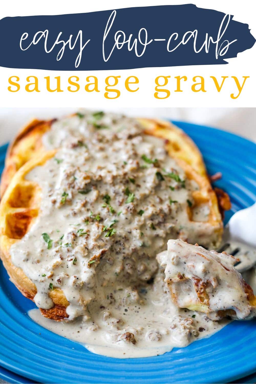 low-carb sausage gravy poured over chaffles on a blue plate 