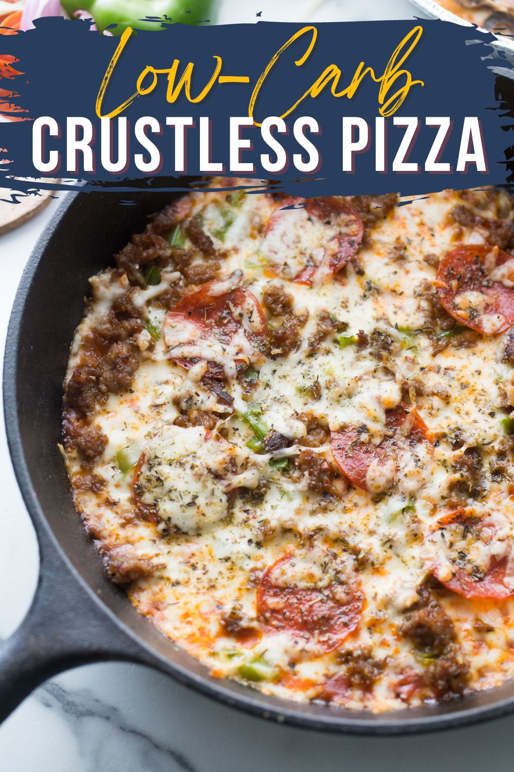 Crustless Pizza in a cast iron skillet on a marble background with test on the image