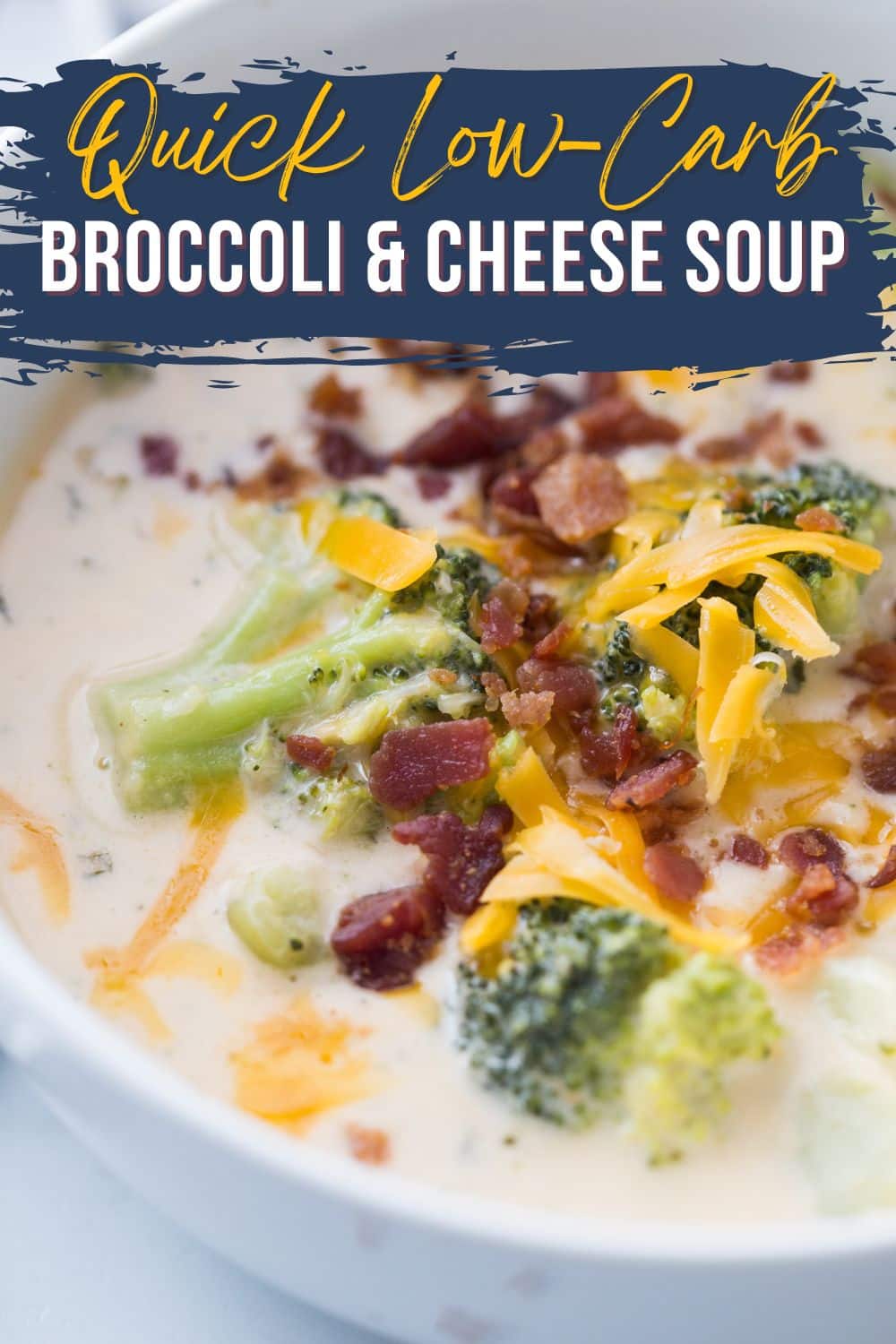 close shot of broccoli cheddar soup in a white bowl