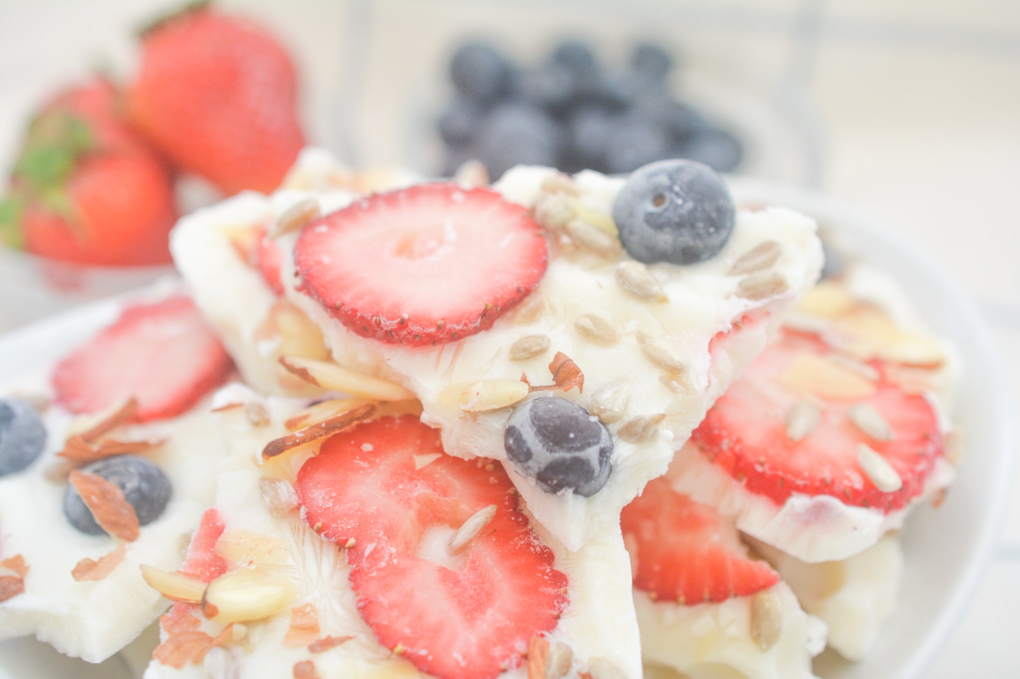 close up photo of yogurt bark with strawberries and blueberries 