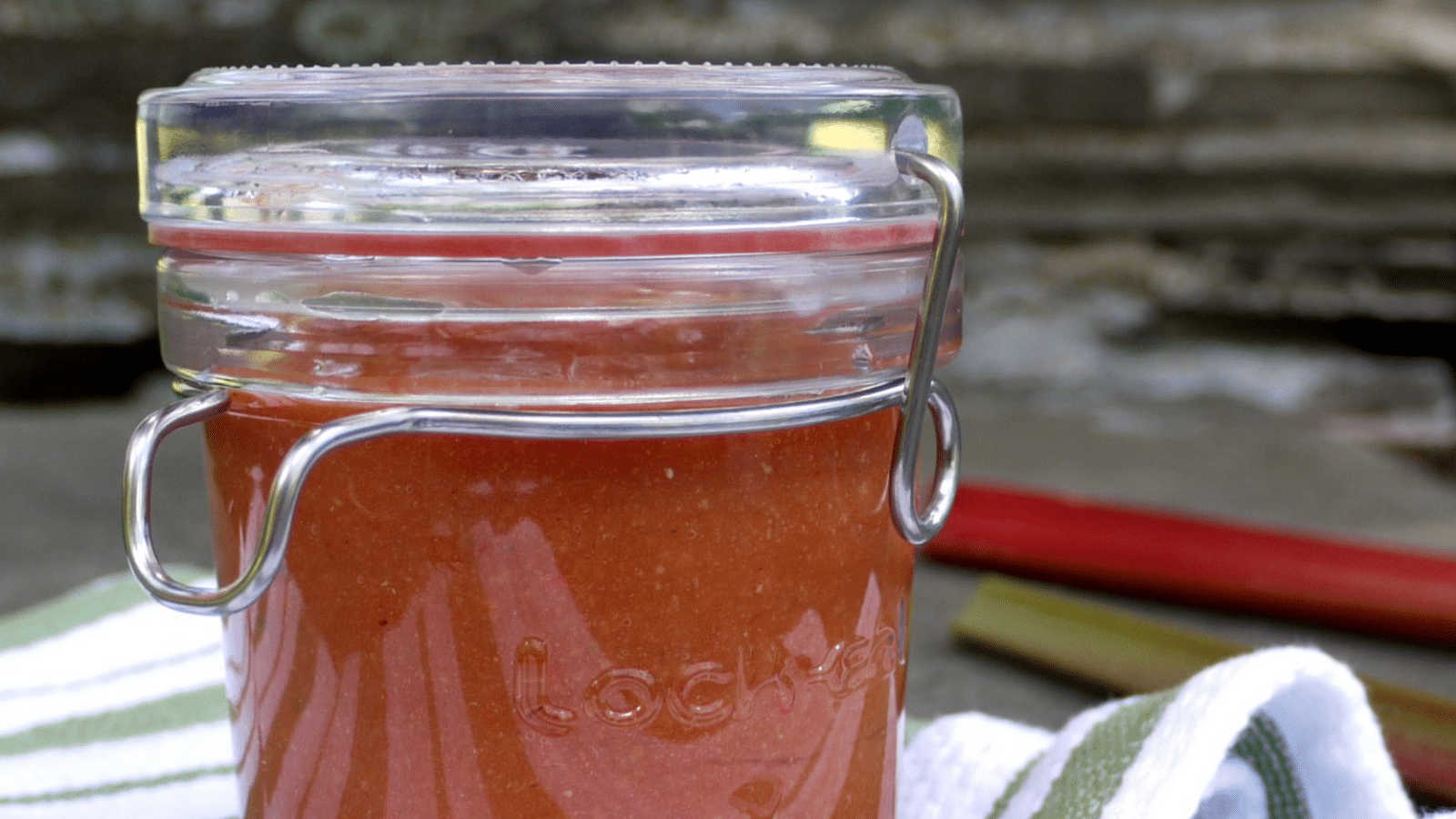 Rhubarb BBQ sauce in a mason jar with the lid closed