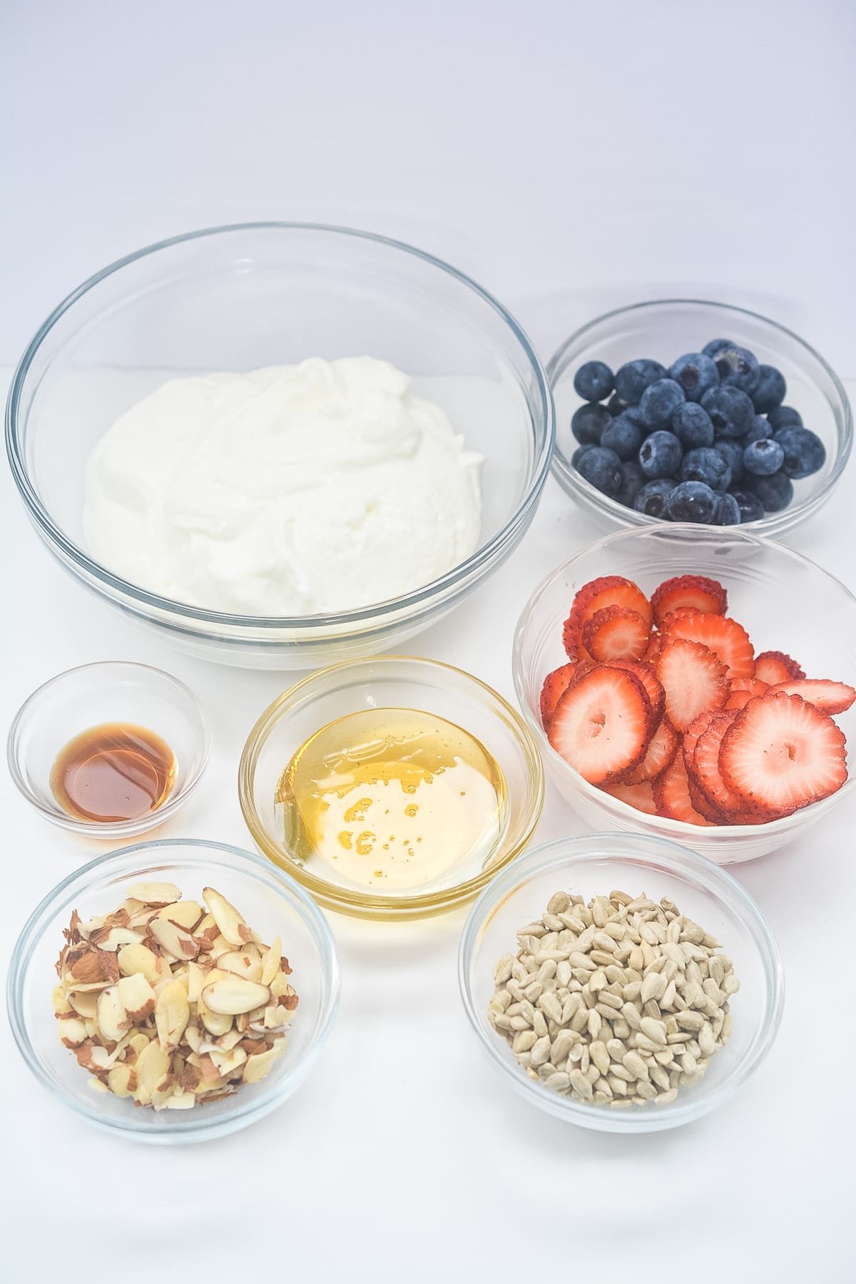 flat lay of ingredients for yogurt bark in a clear bowl