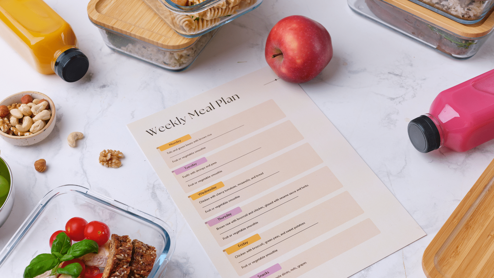 meal planning paper on a counter with food surrounding it
