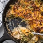 featured image of chicken bacon ranch casserole in a cast iron skillet with a spoon in it
