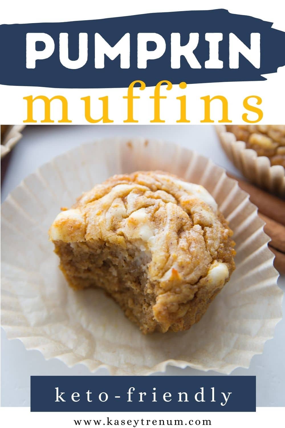 close up shot of a pumpkin muffin with a cheesecake filling with a bite taken out of it and the muffin paper opened up