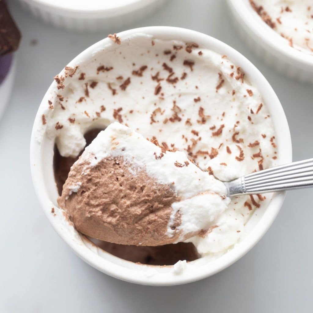 Square image of finished keto chocolate mousse served in white ramekin
