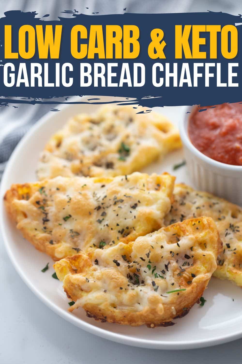 Crispy low carb garlic chaffles sliced open with stretchy melted mozzarella cheese on top and served with marinara sauce for dipping. Keto chaffle bread makes the perfect addition to any Italian meal.