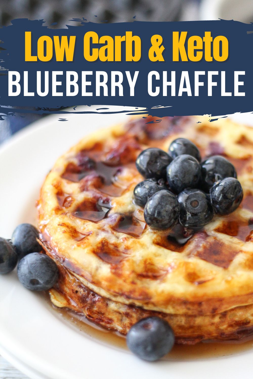 image of blueberry chaffle topped with addittional blueberries and sugar-free maple syrup
