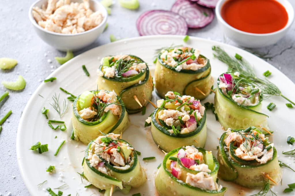 top down shot of cucumber rolls stuffed with buffalo chicken plated 