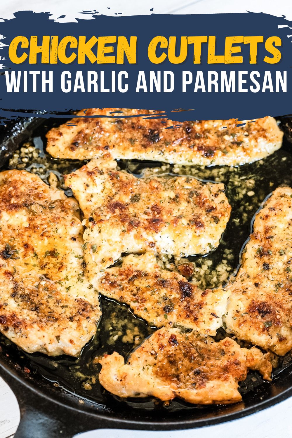 Garlic Parmesan Chicken Cutlets cooked in the oven and served in a cast iron skillet, with a blue banner featuring white and yellow text overlay.
