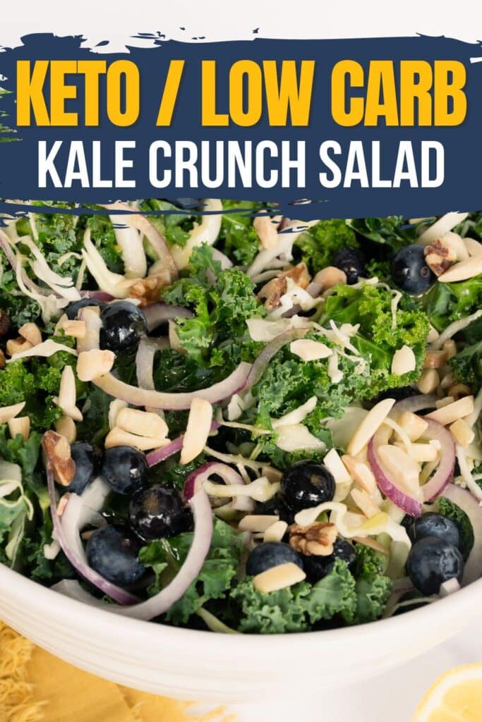 A close-up view of a vibrant Kale Crunch Salad with blueberries and toasted nuts served in a white bowl, showcasing the colorful ingredients and tantalizing textures, accompanied by a blue banner with yellow and white lettering highlighting the salad name.